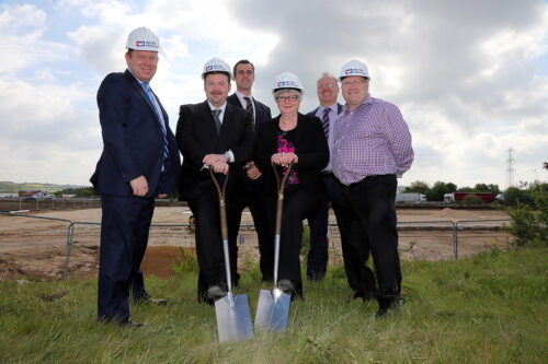 Meter Provida Office Site Launch. Team posing with spades