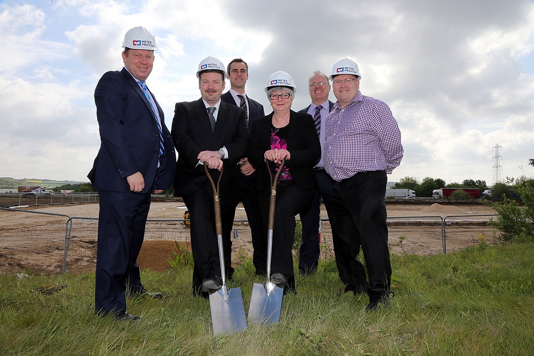 Meter Provida Office Site Launch. Team posing with spades