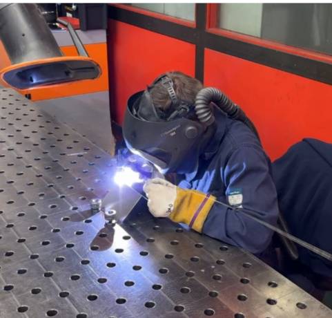 PCML Staff welding a part