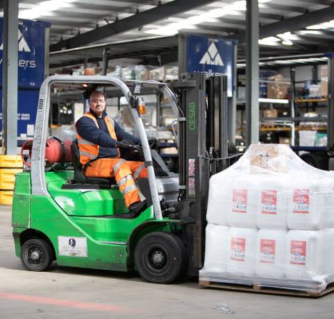 Walkers Transport loading pallets with a forklift