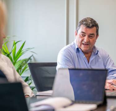 Total Capital Team In A Meeting